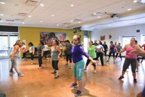 Photo of group of adults led by zumba instructor