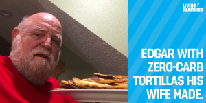A man in a red shirt holds a plate with zero-carb tortillas. Text on the image reads "Edgar with zero-carb tortillas his wife made."